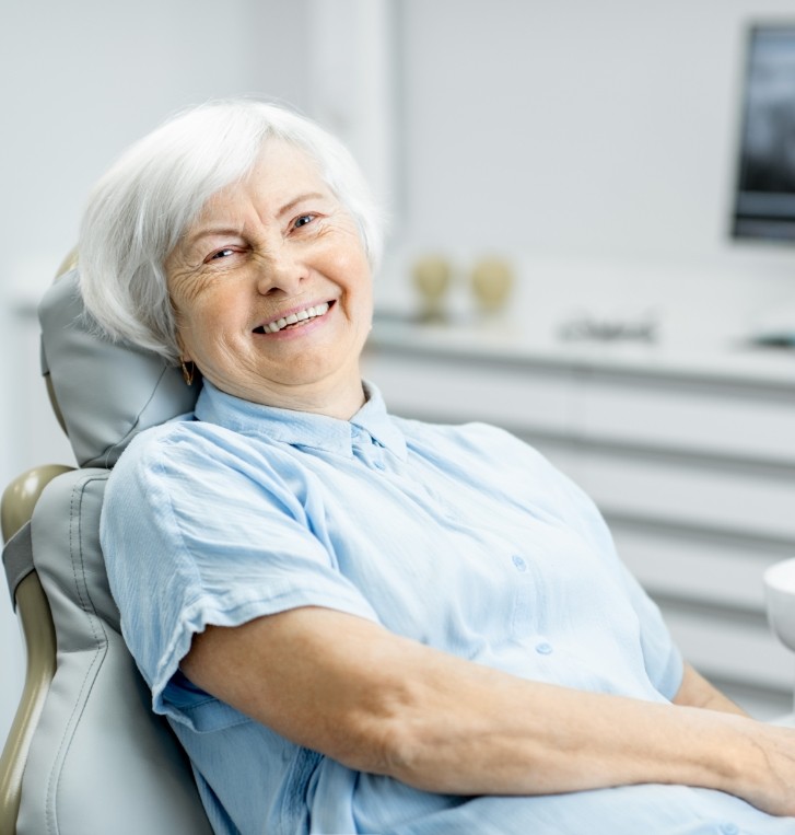 Senior woman grinning in dental chair