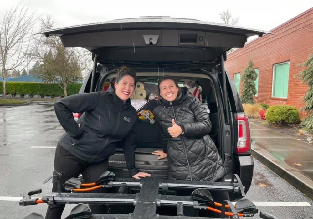 Team members loading up car with donations