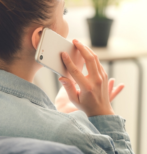 Person talking on phone with Hillsboro dental office