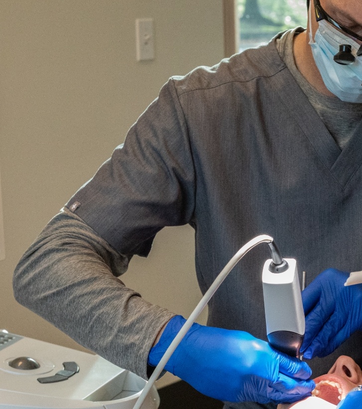 Dentist capturing digital dental impressions of a patient