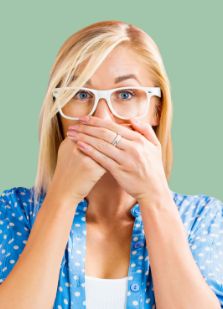 Woman covering her mouth with both hands