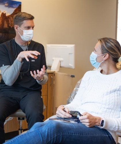 woman talking with dentist