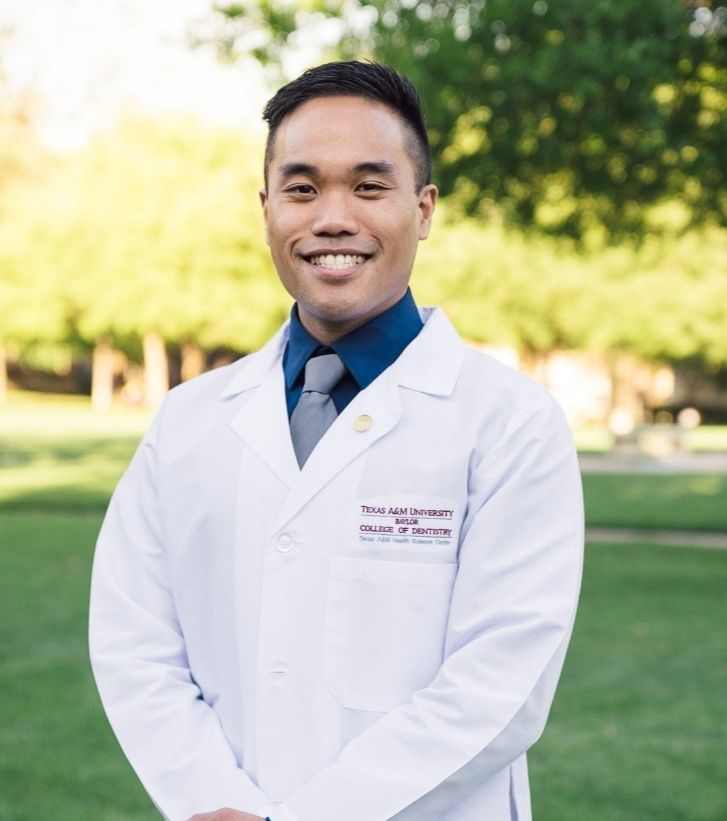 Doctor Brian Bardeloza with Texas A and M lab coat on