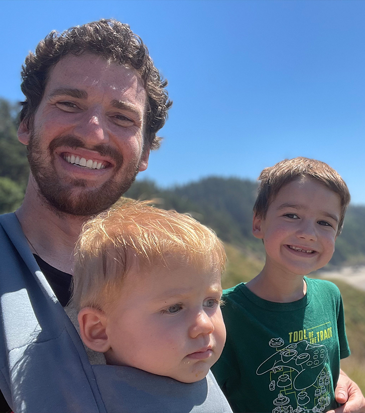 Doctor Proulx with his two young sons outdoors