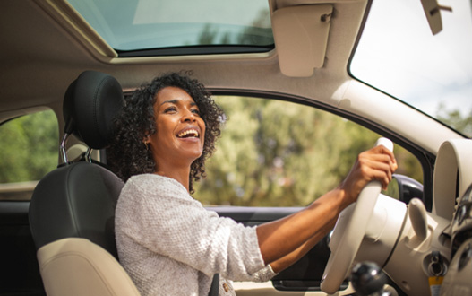 Woman smiling while driving