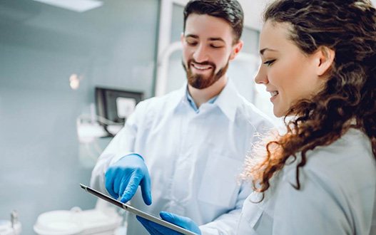 A woman consulting her dentist about oral conscious sedation