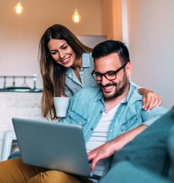 Man and woman looking at laptop for recommended dental products in Hillsboro