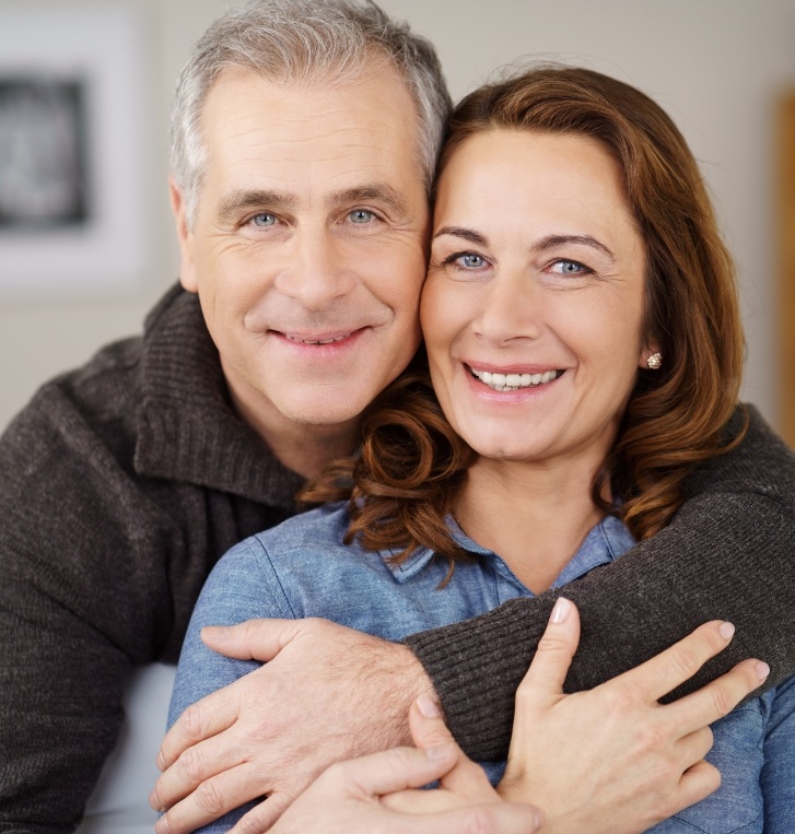 Man and woman smiling after restorative dentistry in Hillsboro