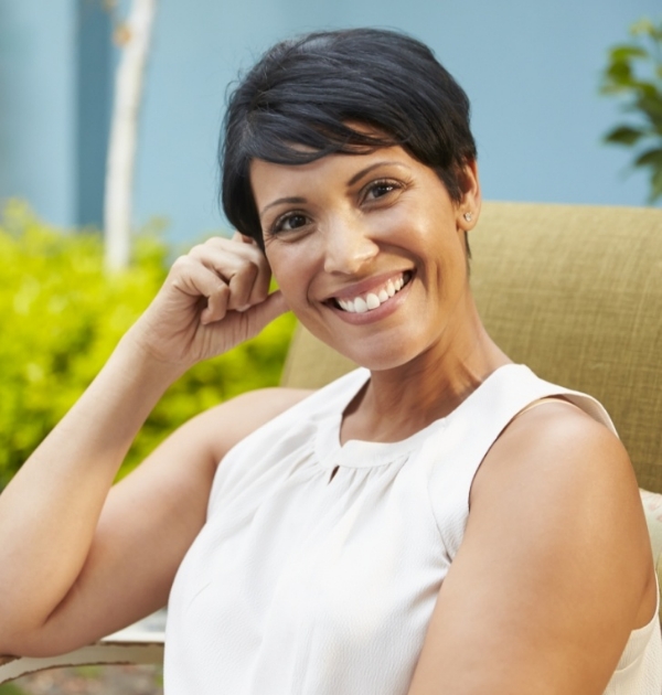 Woman smiling after using special dental offers in Hillsboro