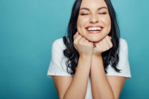 Woman with beautiful smile thanks to cosmetic dentistry in Hillsboro