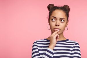 Woman wondering why she needs a tooth extraction